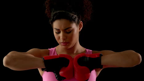 Fit-woman-in-pink-wearing-boxing-gloves
