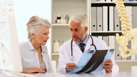 Doctor-explaining-a-spine-xray-to-patient