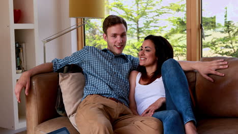 Cute-young-couple-relaxing-on-the-couch