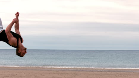 Martial-arts-expert-practicing-on-the-beach