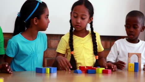 Pupils-playing-with-building-blocks-in-classroom