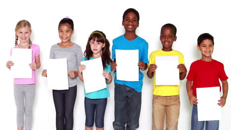 Cute-little-children-covering-face-with-white-paper