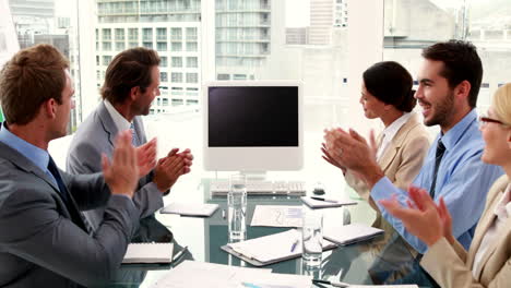 Business-team-clapping-a-blank-screen