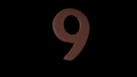 Die-Zahl-9-Steigt-Auf-Schwarzem-Hintergrund
