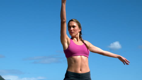 Fit-blonde-doing-yoga-on-sunny-day