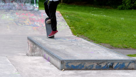 Young-skateboarder-skating-the-outdoor-skatepark