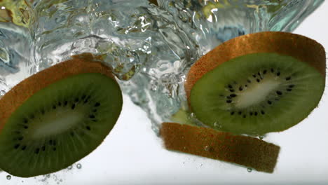Kiwi-slices-falling-into-water-
