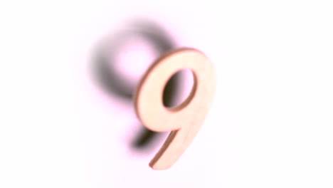 Die-Zahl-9-Steigt-Auf-Weißem-Hintergrund