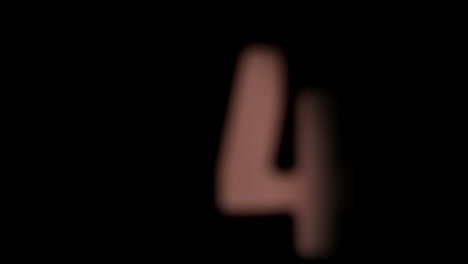 The-number-4-rising-on-black-background