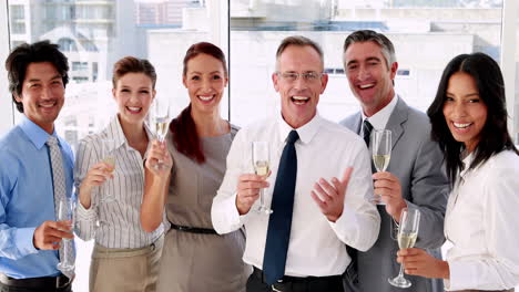 Business-team-celebrating-with-champagne