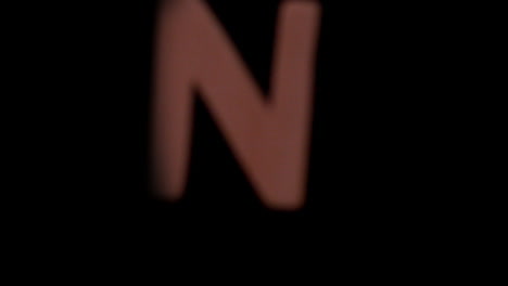 The-letter-n-rising-on-black-background