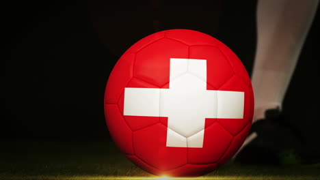 Jugador-De-Fútbol-Pateando-La-Pelota-Con-Bandera-Suiza.