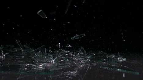 Glass-falling-and-smashing-into-pieces