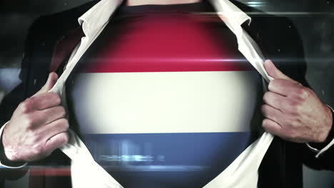 Businessman-opening-shirt-to-reveal-dutch-flag