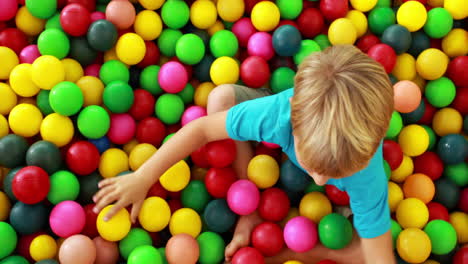 Cute-boy-playing-and-having-fun-in-the-ball-pool