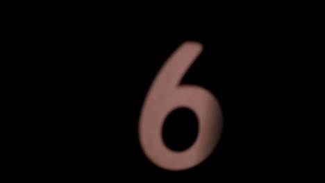 The-number-6-rising-on-black-background