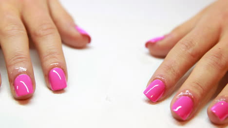 Hands-showing-fresh-pink-manicure
