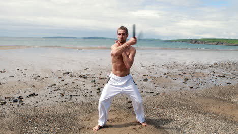 Fit-shirtless-man-practicing-martial-arts