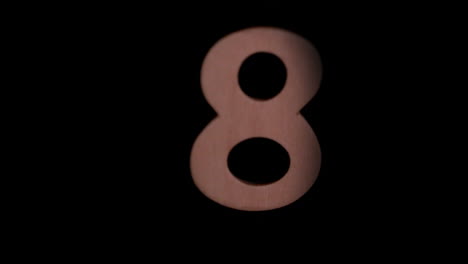 The-number-8-rising-on-black-background