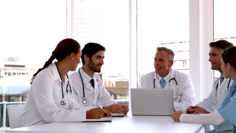 Medical-team-meeting-together-with-laptop
