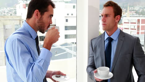 Businessmen-chatting-and-drinking-coffee