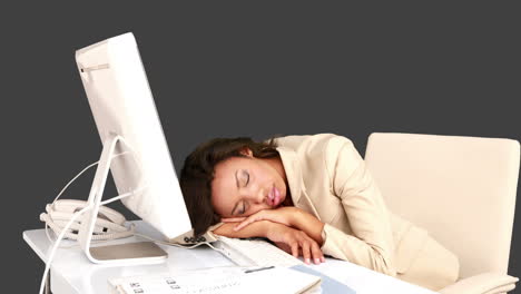 Businesswoman-sleeping-on-her-desk