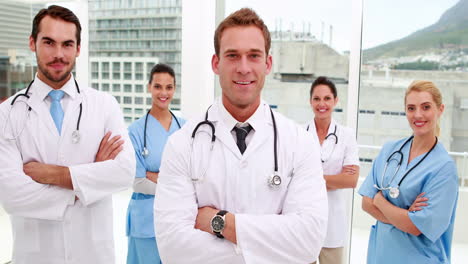 Medical-team-smiling-at-camera-together