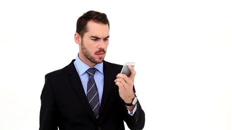 Angry-businessman-talking-on-his-phone