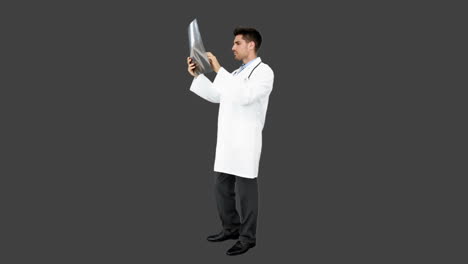 Young-doctor-standing-with-x-ray