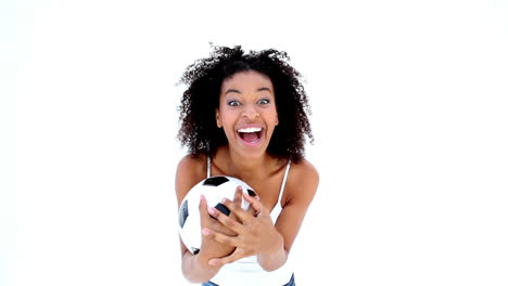 Pretty-girl-in-white-holding-football