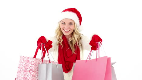 Festive-young-blonde-holding-shopping-bags