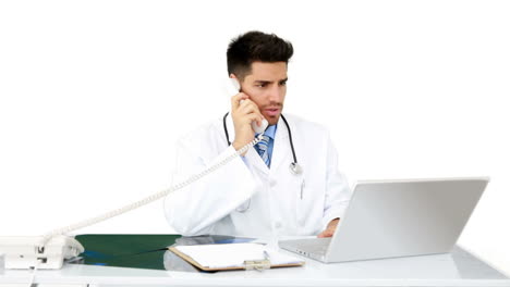 Young-doctor-working-at-his-desk