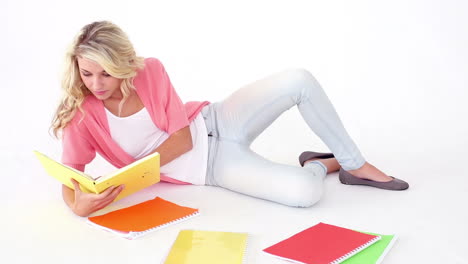 Pretty-young-student-studying-on-floor