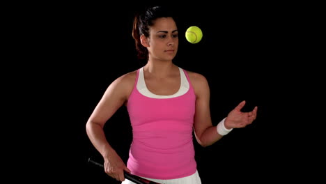 Brunette-tennis-player-bouncing-ball