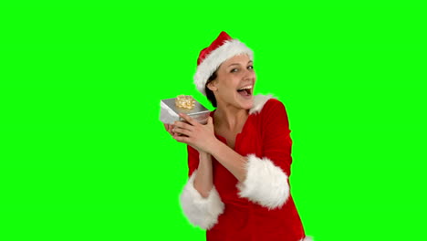 Festive-brunette-shaking-a-gift