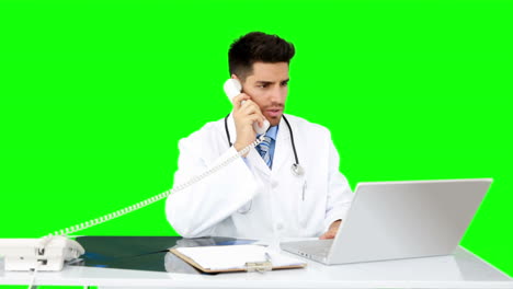 Young-doctor-working-at-his-desk