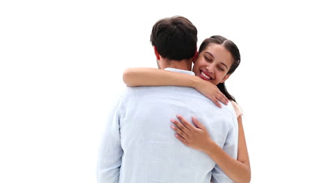 Attractive-young-couple-hugging-and-smiling-at-camera