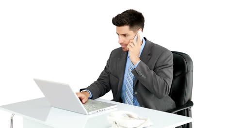 Young-businessman-working-at-his-desk