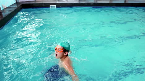 Cute-little-boy-swimming-in-the-pool