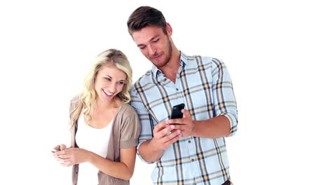 Attractive-young-couple-texting-on-phones