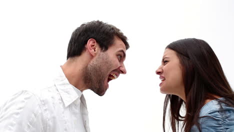 Angry-young-couple-shouting-at-each-other