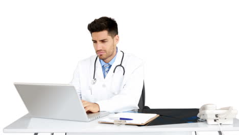 Young-doctor-working-at-his-desk