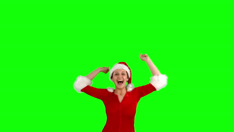 Festive-brunette-jumping-on-green-screen