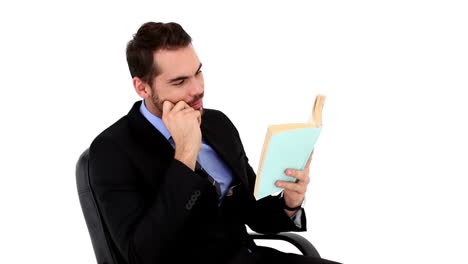 Young-businessman-reading-a-book