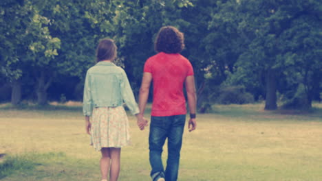 In-high-quality-format-happy-couple-walking-in-the-park-