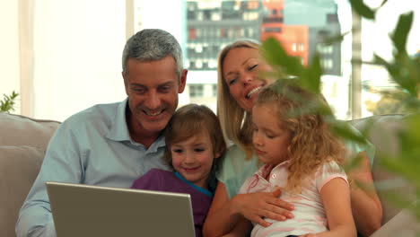 Happy-family-using-tablet-pc-together