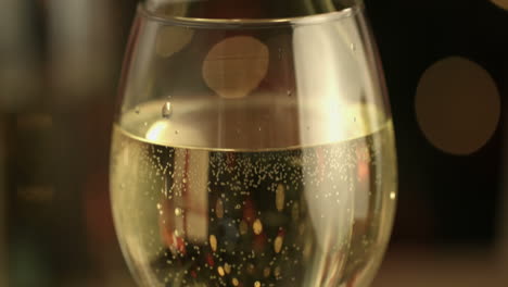 Focus-on-white-wine-glass