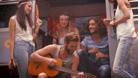 In-high-quality-format-hipster-friends-in-camper-van-at-festival-
