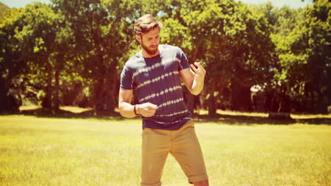 In-high-quality-4k-format-handsome-hipster-playing-air-guitar-