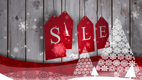 Red-sale-tags-hanging-against-wood-with-festive-border